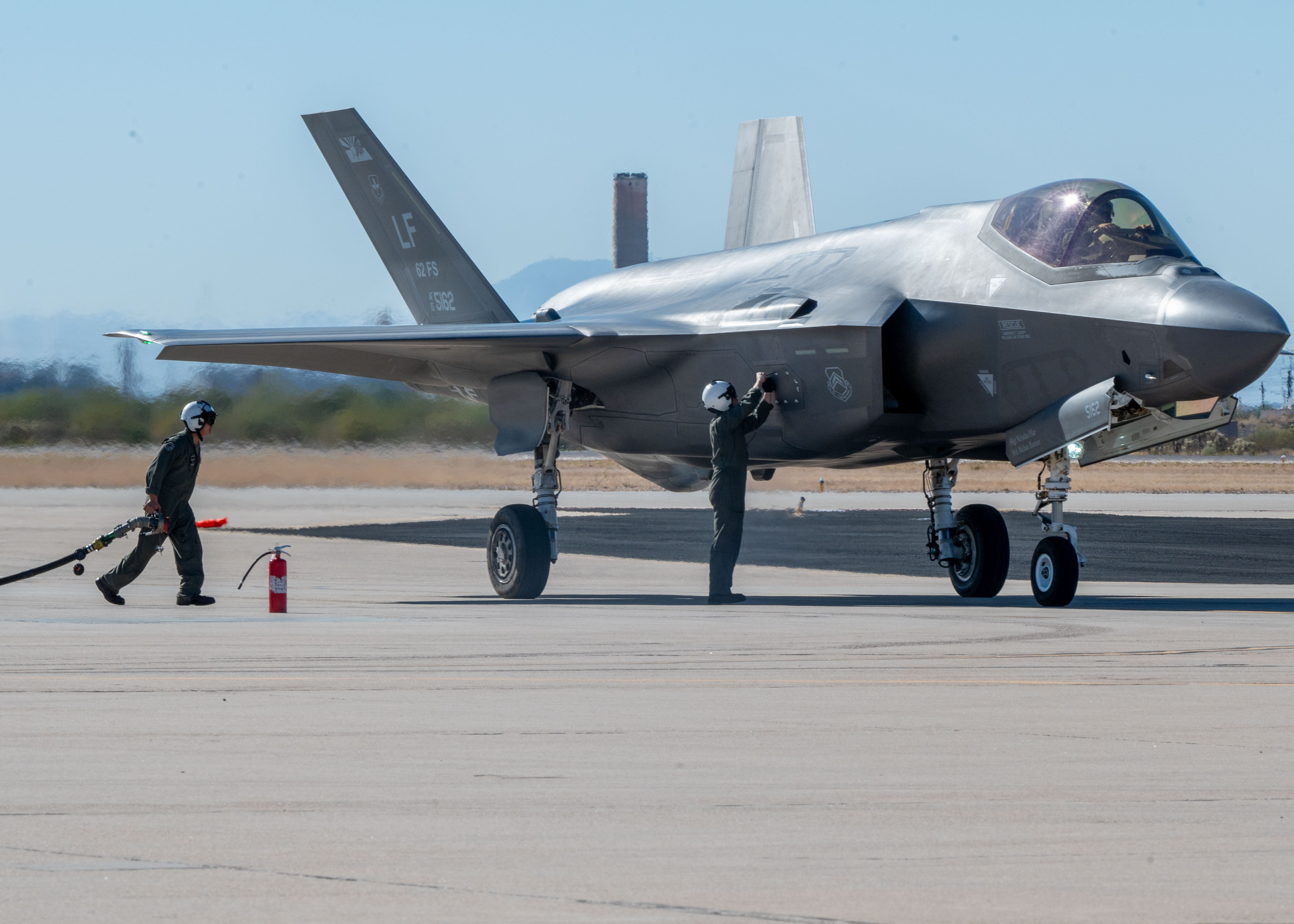 U.S. Marines refuel an F-35 Lightning II aircraft, assigned to the 56th Fighter Wing's 62nd Fighter Squadron, on the flightline at Davis-Monthan Air Force Base