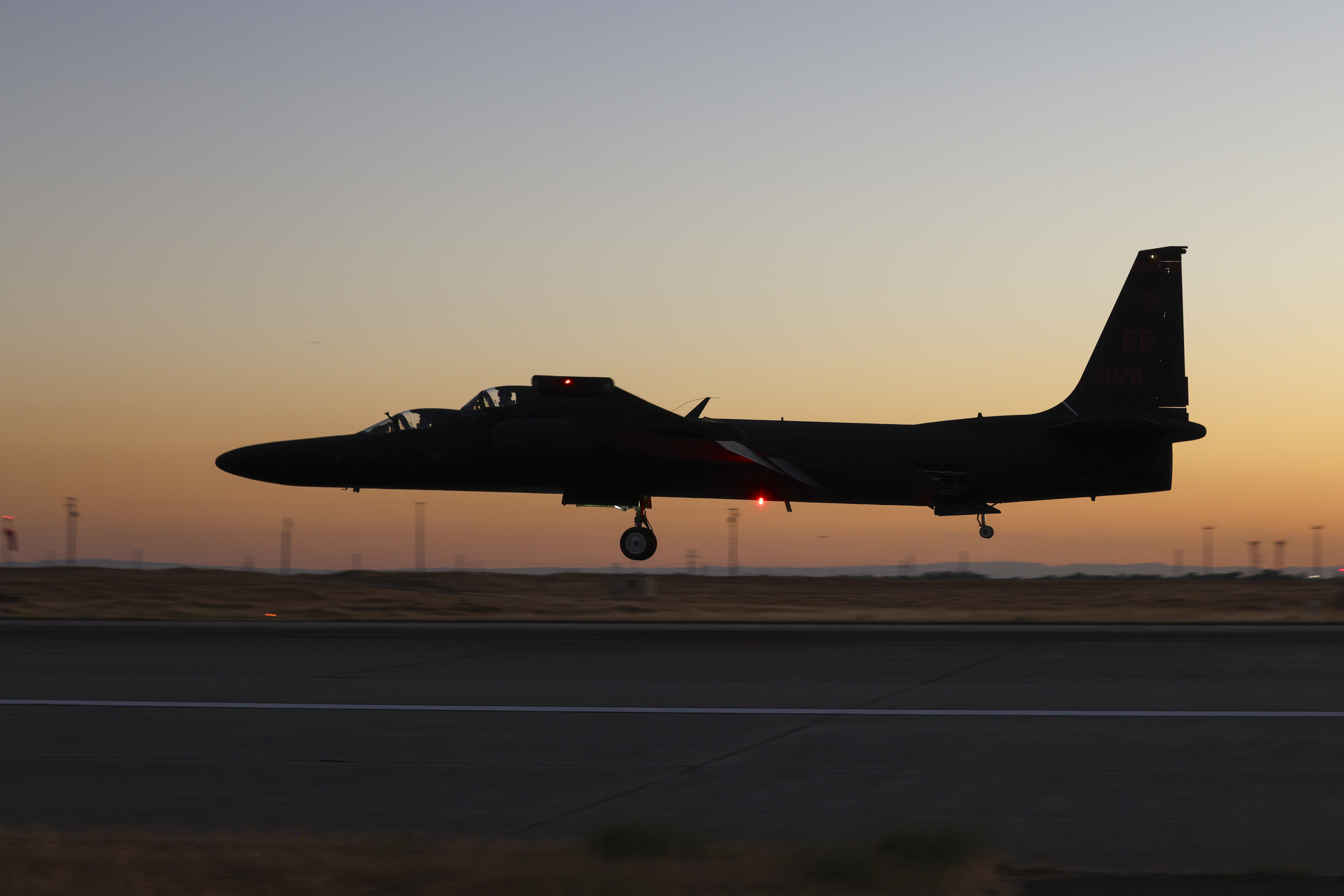 A U.S. Air Force 99th Reconnaissance Squadron TU-2S Dragon Lady performs touch-and-go landings at dusk on Beale Air Force Base, California, Aug. 15, 2024