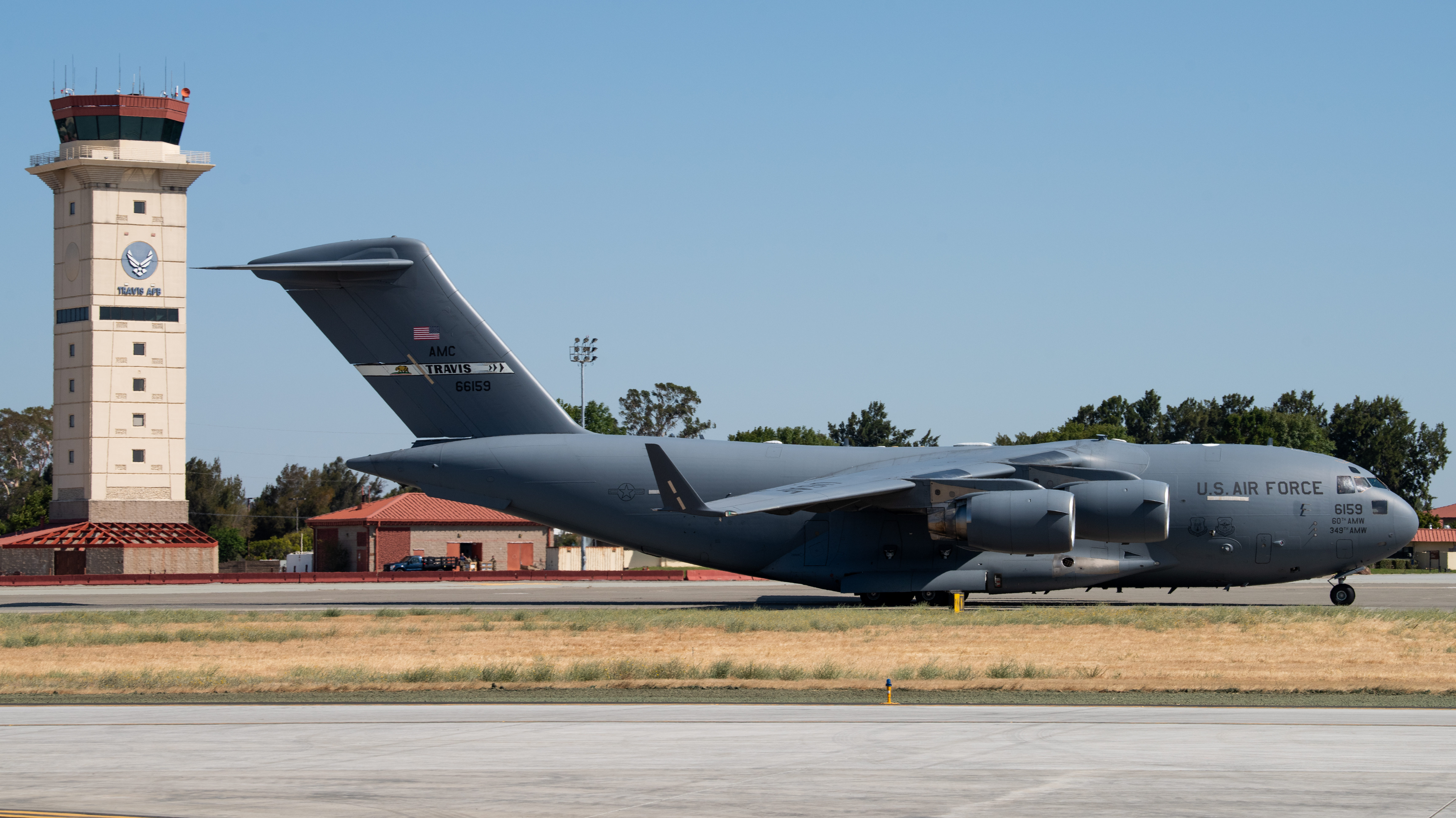 A U.S. Air Force C-17 Globemaster III assigned to the 21st Airlift Squadron taxis on the flight line during a final flight for Col. Steven Byrum, 60th Air Mobility Wing deputy commander, at Travis Air Force Base, California, June 25, 2025
