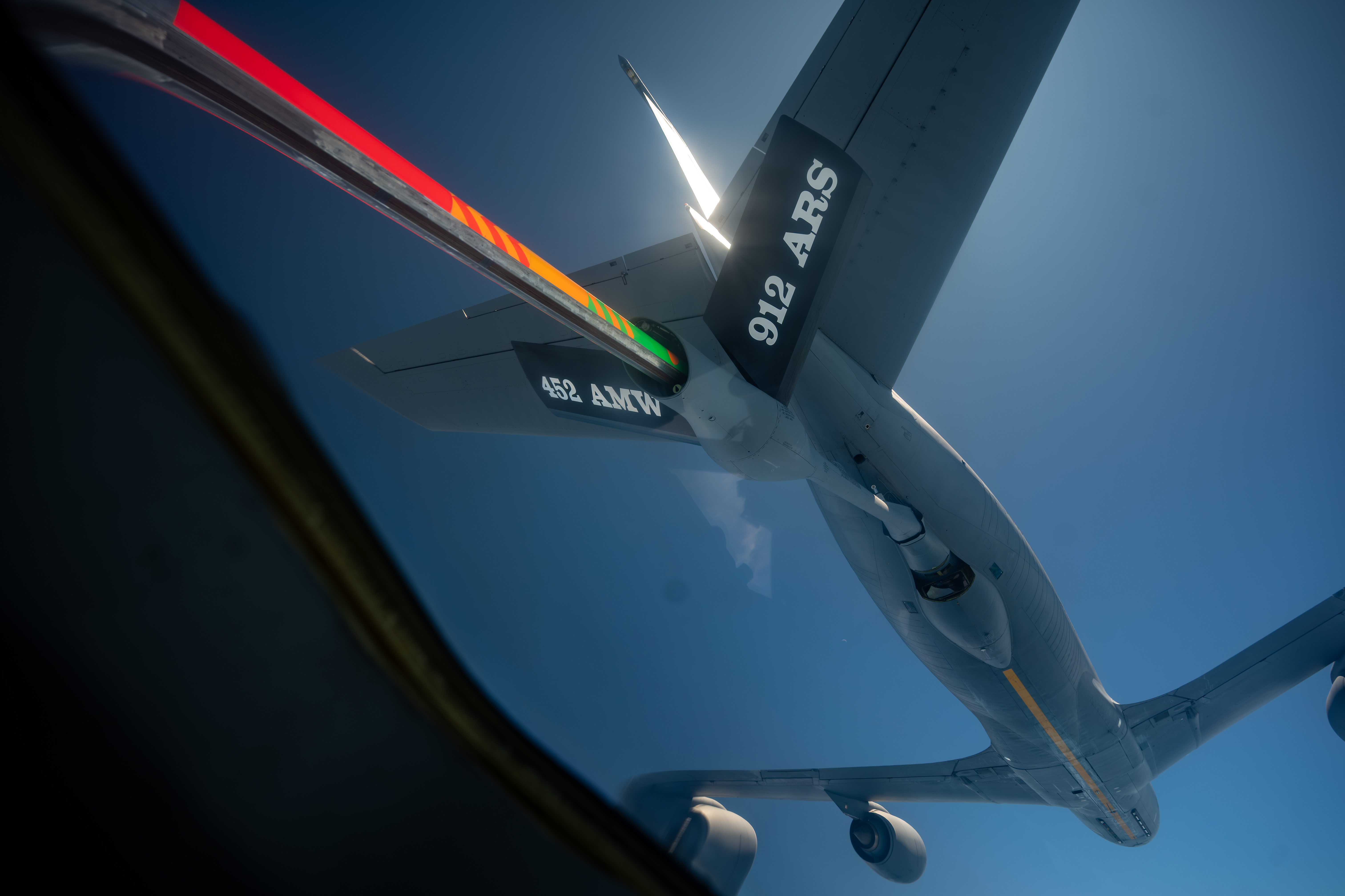 A U.S. Air Force KC-135 Stratotanker assigned to the 912th Air Refueling Squadron, March Air Reserve Base, California, refuels a C-17 Globemaster III assigned to the 60th Air Mobility Wing during a training flight over Northern California, Aug. 27, 2025