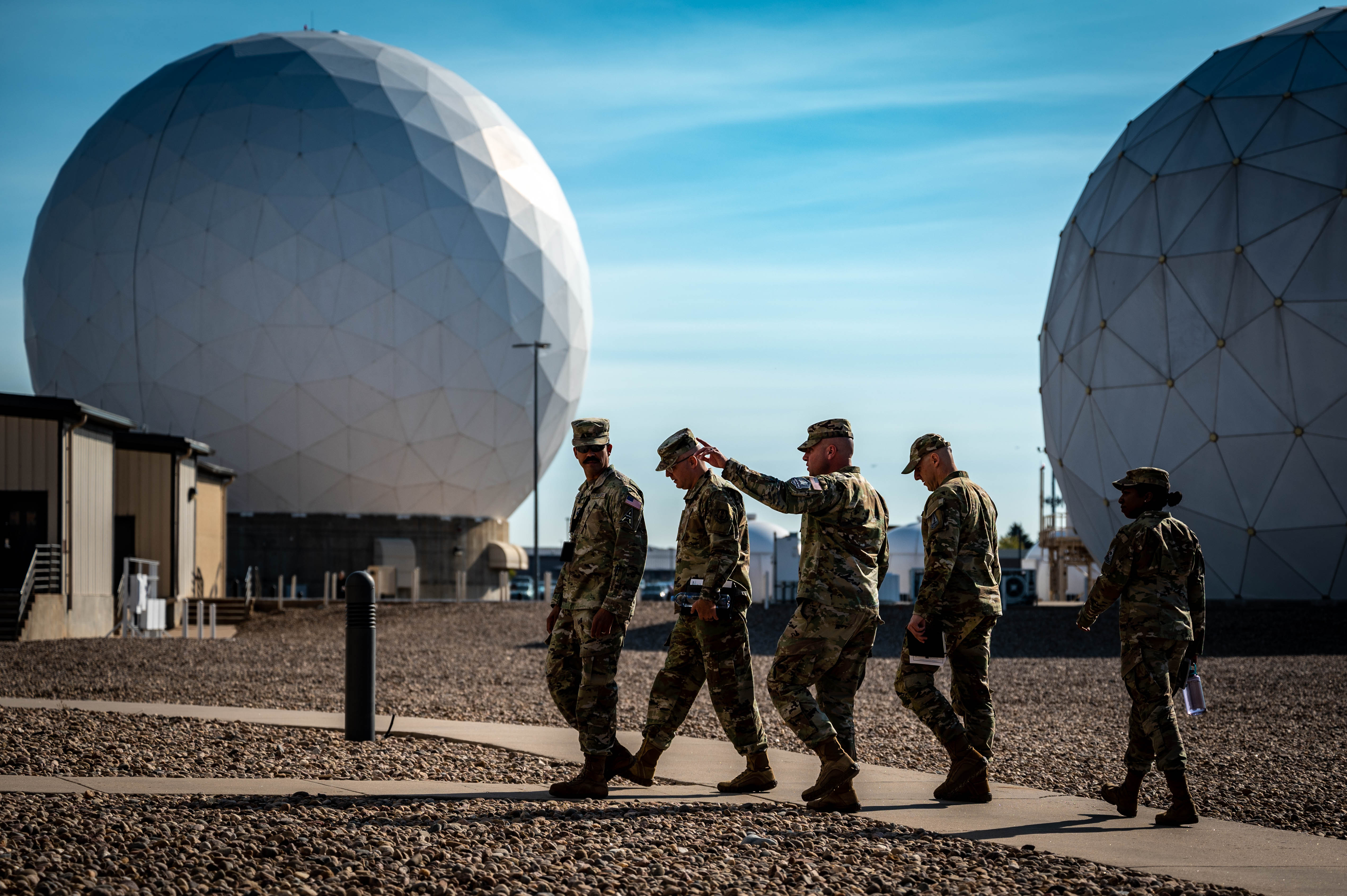 Service members gather a brief at Buckley Space Force Base, Colorado, Oct 8, 2024