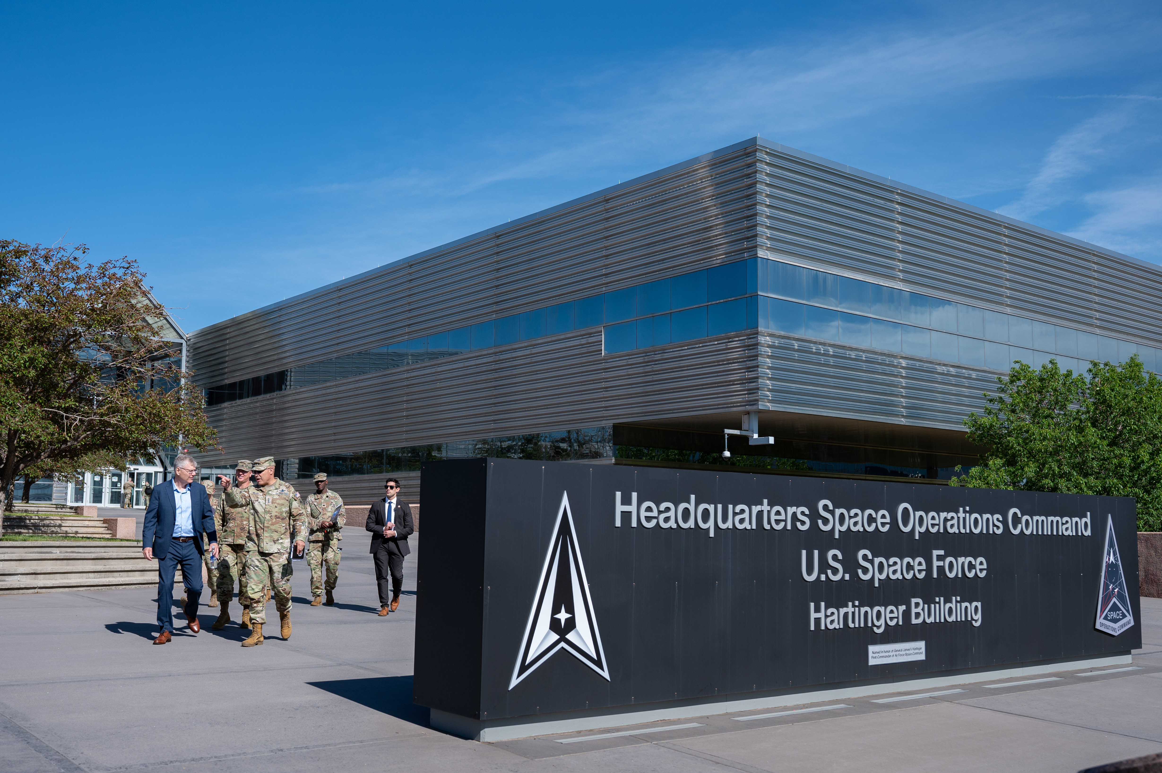 Secretary of the Air Force Troy Meink (left) walks with U.S. Space Force Lt. Gen. David N. Miller, Jr. (pointing ahead), Commander of Space Operations Command, at Peterson Space Force Base, Colorado, May 28, 2025