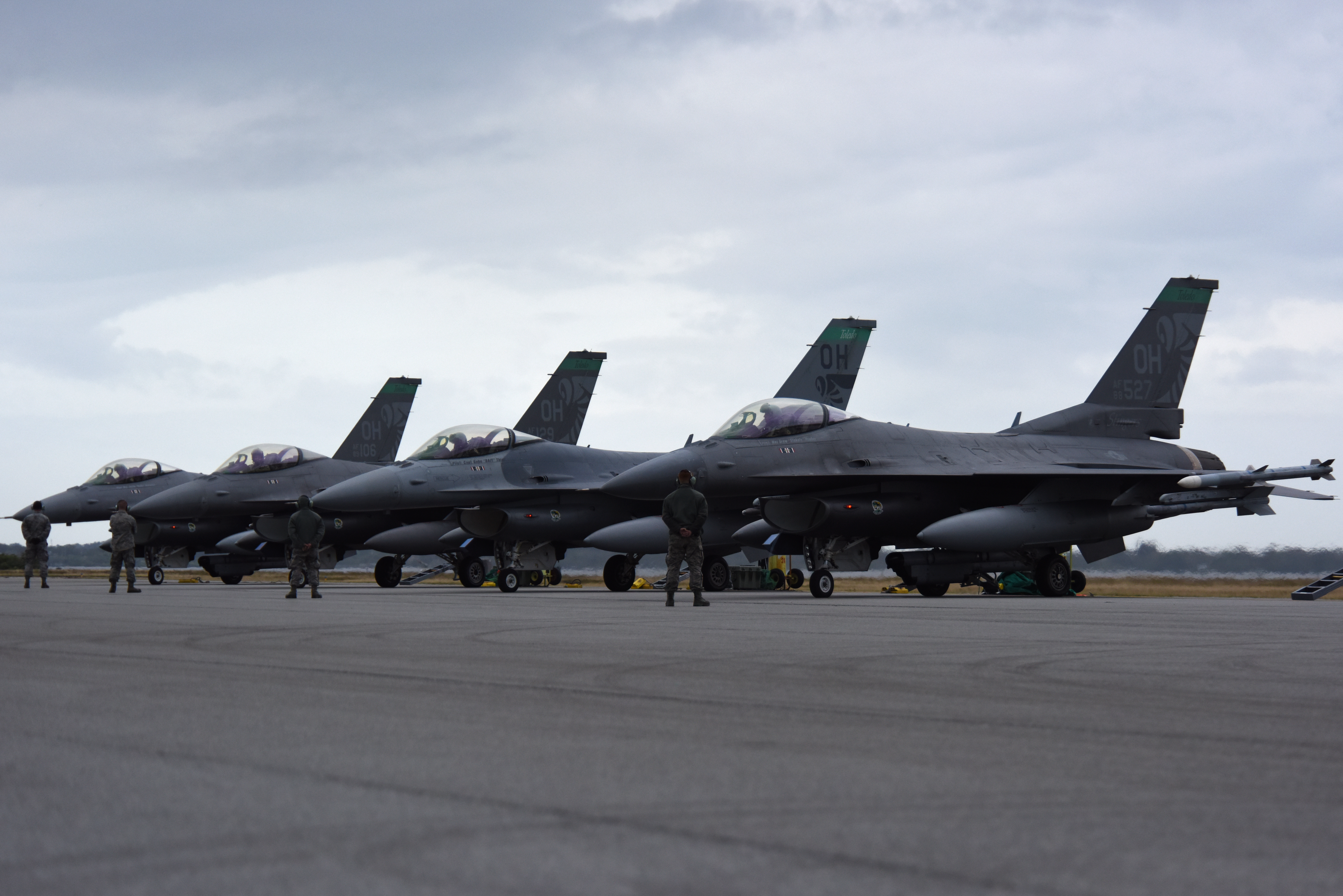 Crew chiefs, assigned to the 180th Fighter Wing, Ohio Air National Guard, wait to marshal out the F-16 Fighting Falcons before an early morning training sortie at Patrick Air Force Base, Florida, Jan. 31, 2019