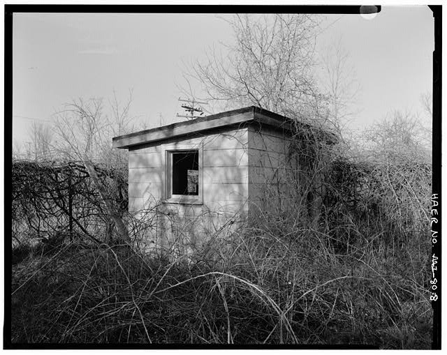 VIEW NORTHWEST, paint shed (north unit)