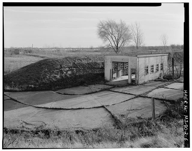 VIEW SOUTHEAST, warhead building with protection beam and drive through paddock