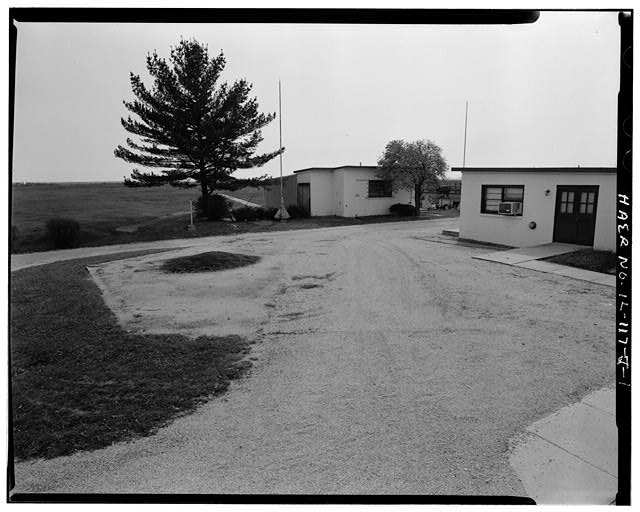 OCTAGON CONCRETE PAD, NOW PART OF PARKING LOT, LOOKING SOUTHEAST